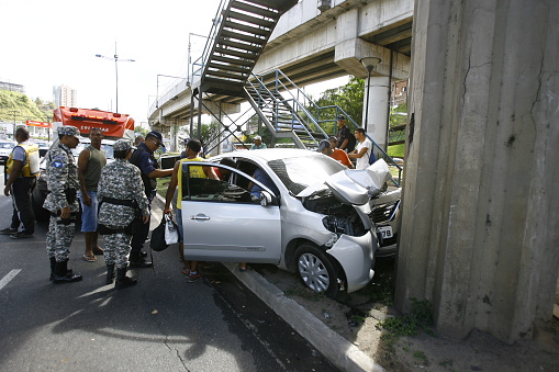 salvador, bahia, brazil - september 14, 2014: Nisan Versa vehicle collides head-on into one of the support pillars of a pedestrian overpass in the city of Salvador.