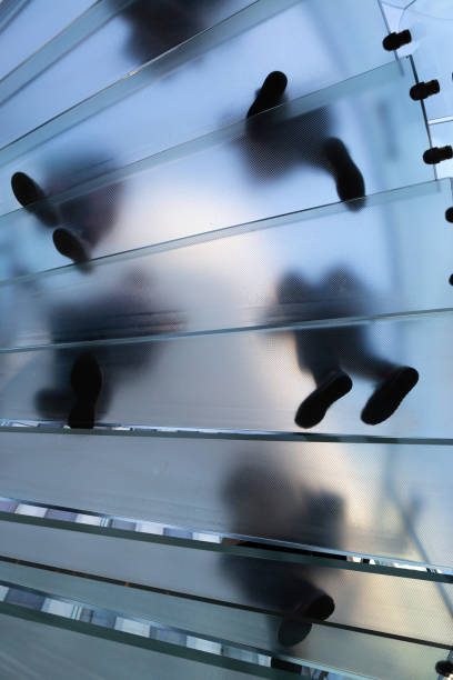 istock People climbing a glass staircase 1364495021
