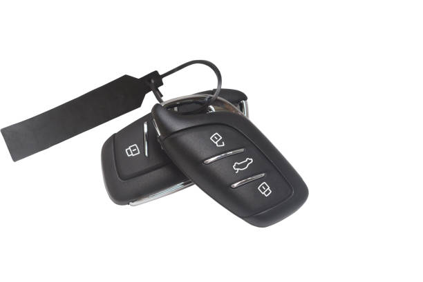A remote control set of digital car key with unlockable and lockable buttons is isolated on white background.