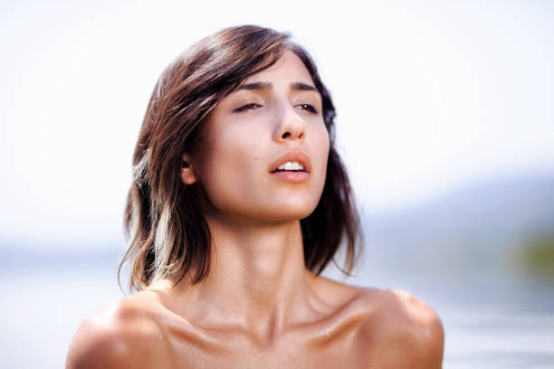 istock girl posing in water near a beach 1364496050