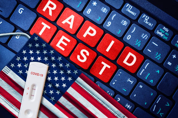 istock COVID-19 Antigen Rapid Test Kit on US Flag 1364500778