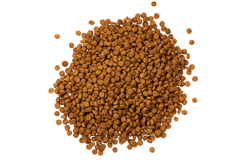 Dry dog food isolated on white background Pet kibble Top view