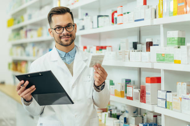 istock Portrait of a handsome pharmacist working in a pharmacy 1364501708