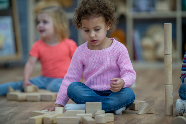 istock Preschoolers building with blocks 1364503800