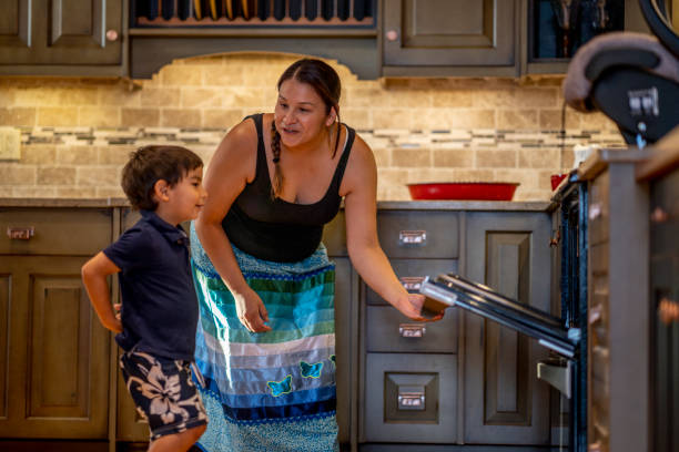 First Nation mother in the kitchen with her kids