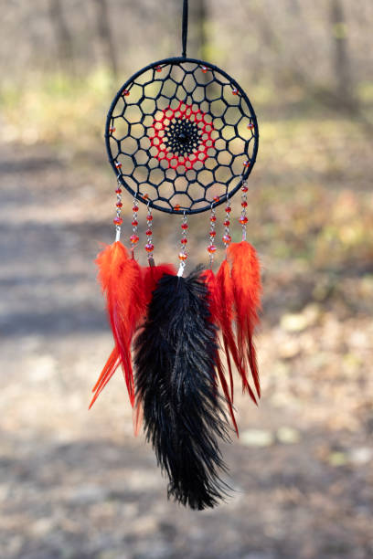 istock Handmade dream catcher with feathers threads and beads rope hanging 1364506917