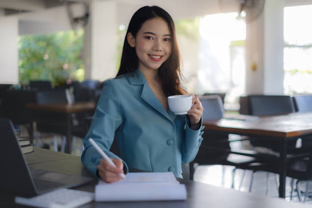 istock Business woman working to analyze technical price graph and indicator. account or saving money or insurance concept. 1364511580
