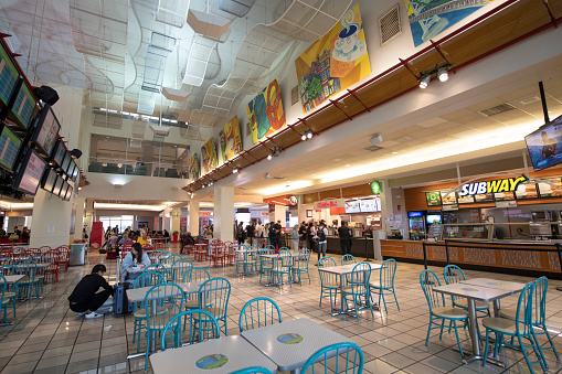 Philadelphia, USA - September 4, 2021. Travelers dining at food court inside the terminal of Philadelphia International Airport, Philadelphia, USA