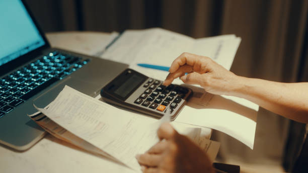 istock Asian women calculate personal budget 1364513363