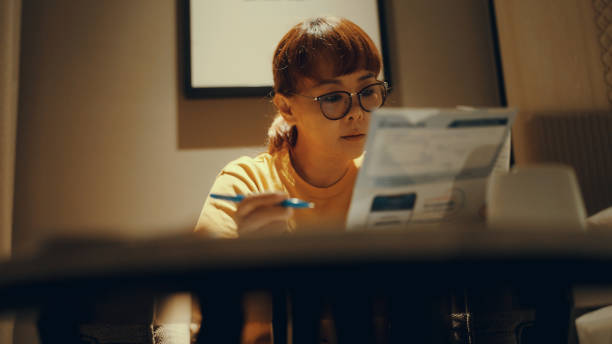 istock Asian women calculate personal budget 1364513365