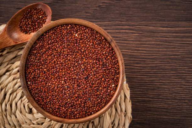 istock Organic red quinoa in a bowl on wooden table background. 1364518554
