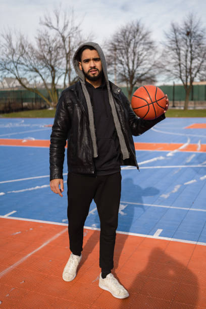 istock Latino boy playing basketball 1364519210