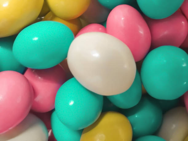 istock multicolored candied almonds with chocolate, top view. 1364519499