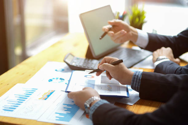 istock Businessmen discussing and making a financial plan. 1364520140