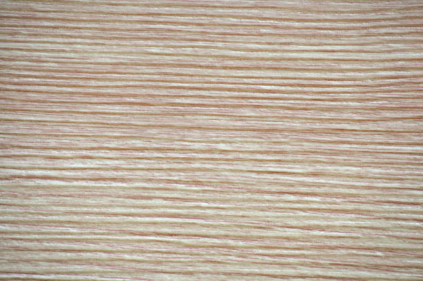 Pink alder, a flat surface of natural wood with a striped pattern, close-up. Background, pattern, texture.
