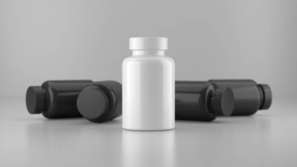 White mock up vitamin bottle surrounded by a black vitamin bottle.