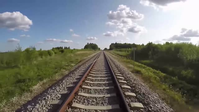 Low-level aerial drone view of railroad tracks.POV
