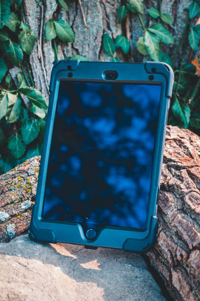 istock Tablet sitting out in nature 1364532667