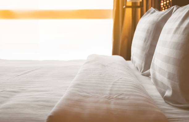 istock Bedroom with bed and white linen 1364533695