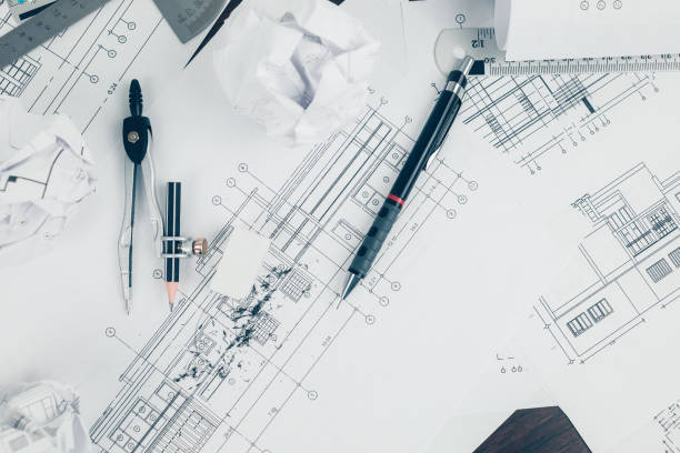 istock eraser crumbs, compass and pencil  on drawing design working on blueprint. House planning design and construction concept. 1364534264