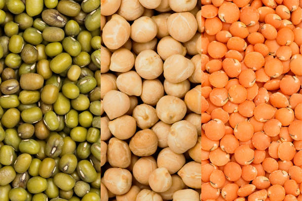 istock Red lentils, chickpeas, mung bean. Background or texture. Macro, top view 1364535347