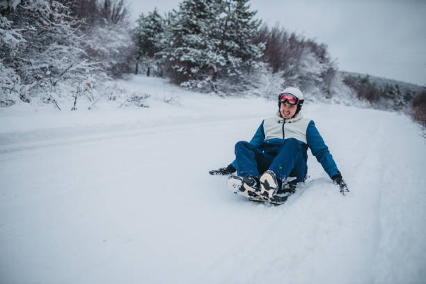 istock A man on a snowboard rides down the side of the mountain 1364536585