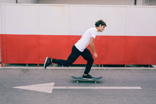 istock young man with his skateboard 1364537870