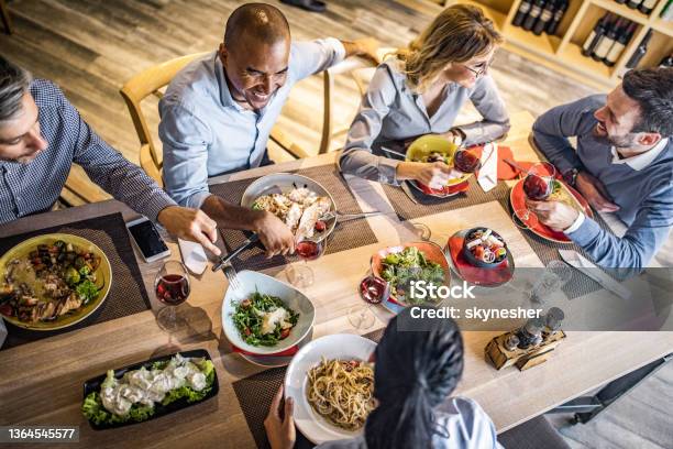 Above View Of Group Of Happy Business People Talking On A Lunch Stock Photo - Download Image Now
