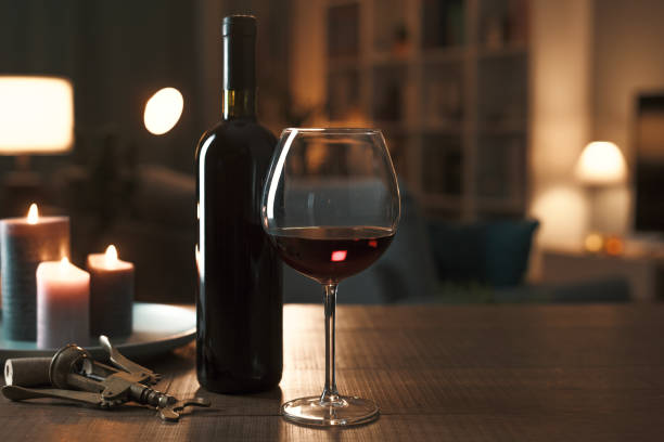 Excellent red wine tasting at night stock photo