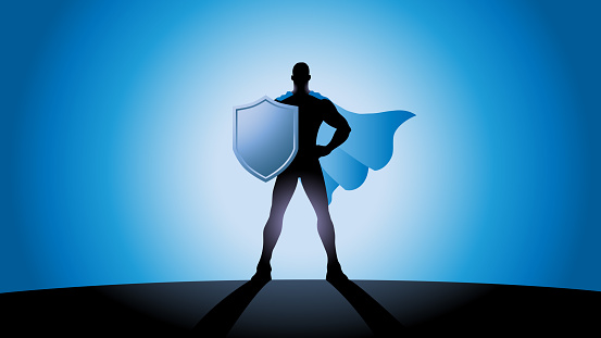 A silhouette style vector illustration of a superhero wielding a shield. Spaces available for your copy.