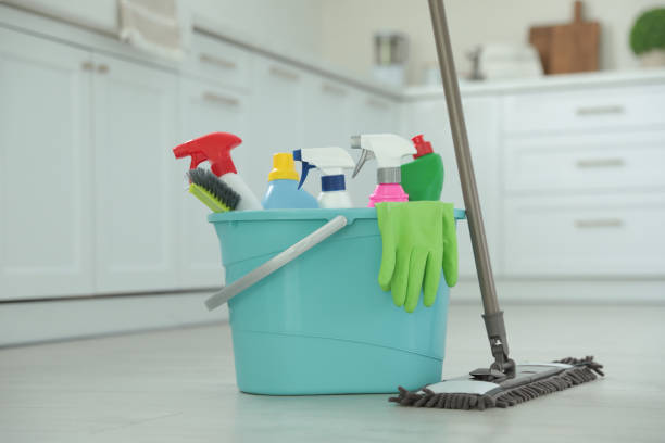 istock Mop and plastic bucket with different cleaning supplies in kitchen 1364548665