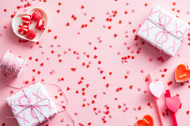 istock Happy Valentines Day concept. Flat lay composition with gift boxes, confetti, festive decorations on pink background. 1364548969