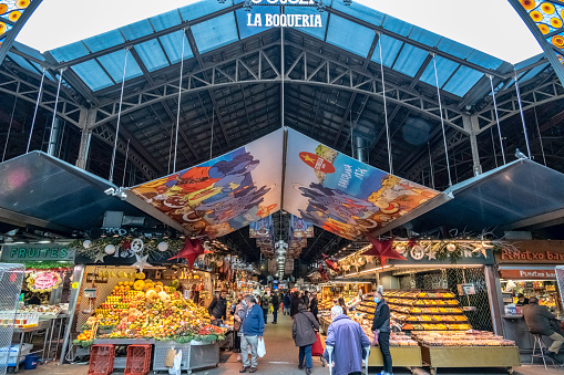 December 17, 2020.  Mercat de la Boqueria, Barri Gotic, Barcelona, Catalonia, Spain.\n\nThe Boqueria market is the most famous in Barcelona. Located in the heart of the Ramblas is a focus of attention for all tourists visiting the city but although the outside of the market is very focused on serving tourists, if you go inside you can still find the classic and historic lifelong stalls.