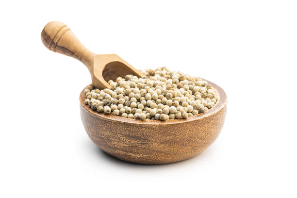 istock Whole pepper spice. White peppercorn grain 1364555629