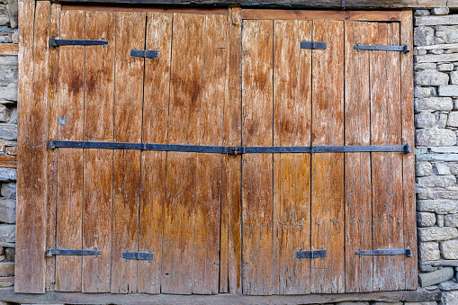 Vintage closed wooden doors in the village