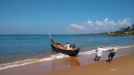 December 2021, Thiruvananthapuram, Kerala, India, Unidentified local fishermen, Kovalam beach, Thiruvananthapuram, seascape view