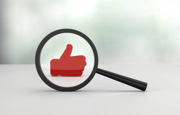 istock Magnifying glass and Like icon 1364558025