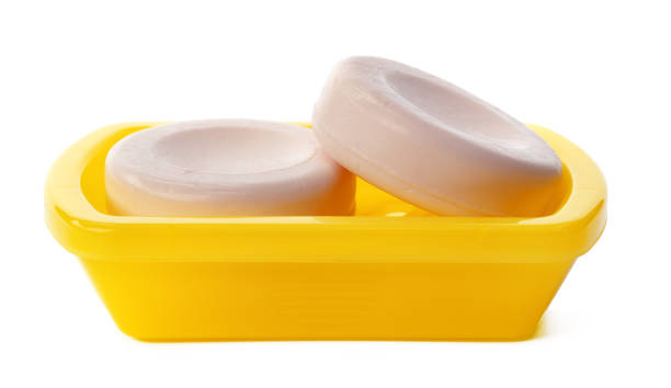 istock Soap on a plastic soap dish isolated on a white background 1364559023