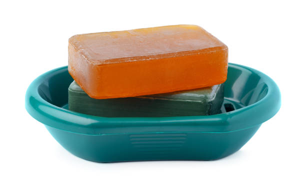istock Soap on a plastic soap dish isolated on a white background 1364560582