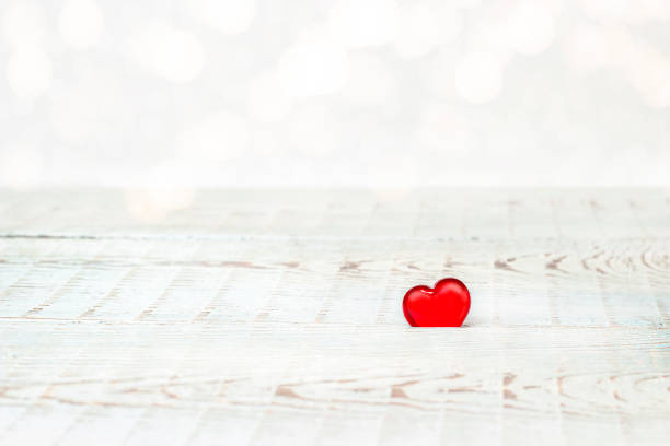 istock red heart on blue wooden planks 1364561445