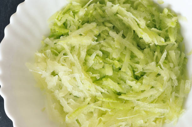 istock green radish salad in a white plate - top view 1364562036
