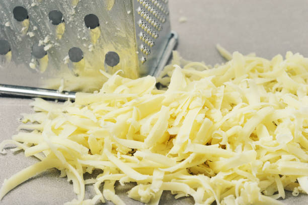 istock grated cheese and an iron cheese grater 1364563058