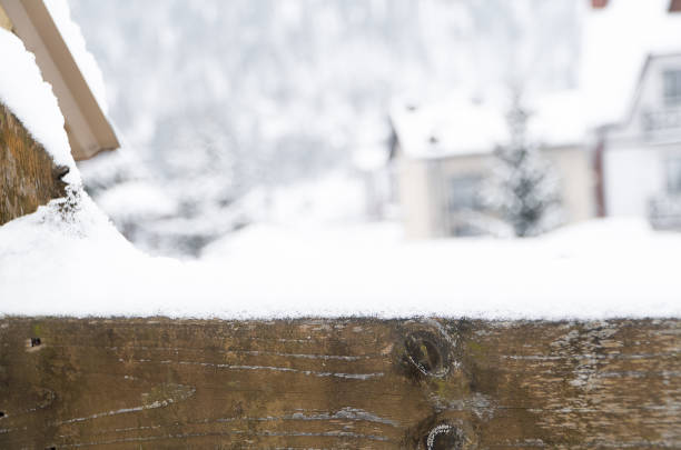 istock Wooden plank covered with snow with space for text. 1364563128
