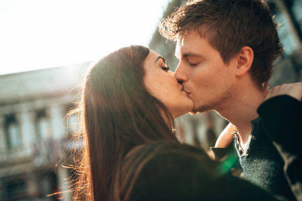 istock passionate couple kissing at the sun 1364565020