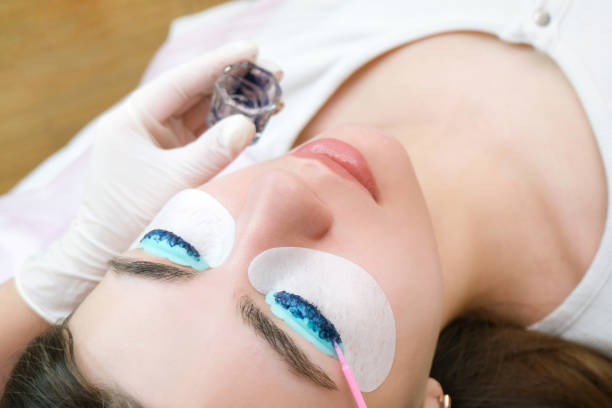 istock Eyelash lamination. Eyelash coloring in the salon 1364565873