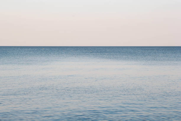 istock Beautiful Still clear blue sea and sky background view 1364566373