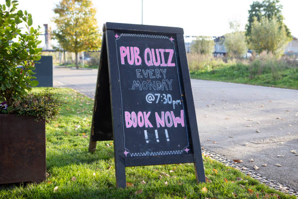 istock Pub quiz advertised on an A-board next to a pedestrian walkway 1364571375