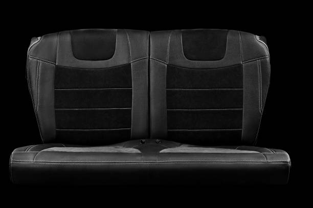 Comfortable double rear passenger car seat isolated on black background stock photo