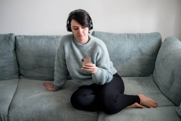 istock Young woman is resting on a sofa 1364573738