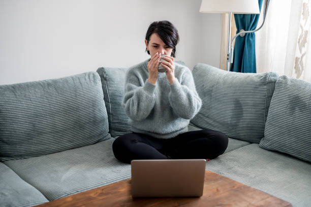 istock Young woman is resting on a sofa 1364573780